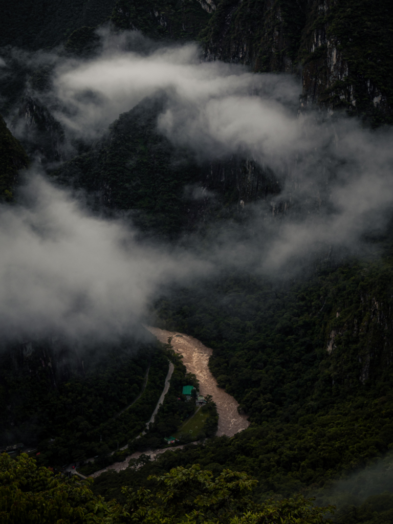 Misty mountain valley near Aguas Calientes with river cutting through the Sacred Valley on the way to Machu Picchu