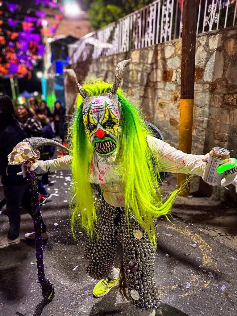 A reveler in costume at the Día de los Muertos parade in Oaxaca 